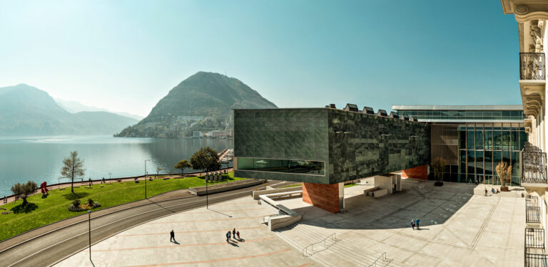 View on the Lugano Arte e Cultura, the Lake of Lugano and the mountains behind